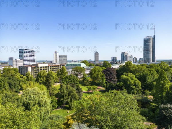 The skyline of Essen city centre, with the RWE Tower on the right and Stadtgarten Park in front,