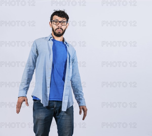 Surprised bearded man looking into the camera isolated. amazed and discovered young man looking at