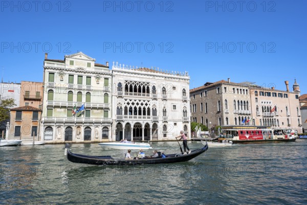 Gondolier with gondola on the Grand Canal, Venice, Veneto, Italy, Europe