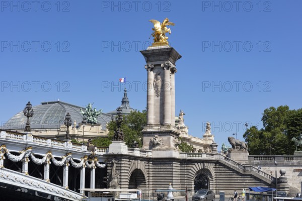Golden sculptures dominate the Alexander III Bridge in Paris, Paris