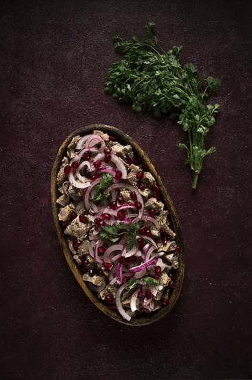 Kuchmachi, Traditional Georgian cuisine, chicken giblets appetizer, with spices and pomegranate