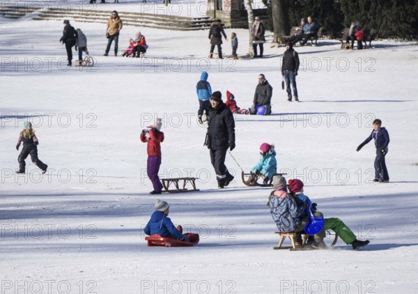 Tobogganing fun in Berlin's snow-covered Viktoriapark. Snow and icy cold continue to dominate the