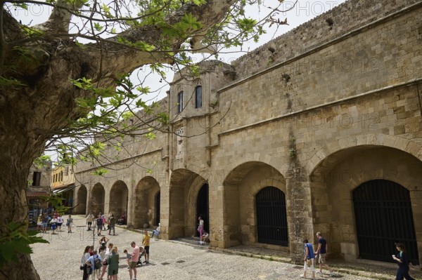 Building of the Archaeological Museum, people walking in front of a large historical building on a