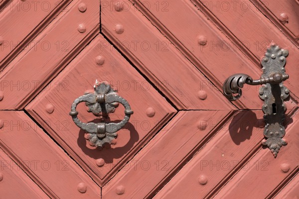Historic door handle and knocker on the front door of the former provost's court of Michelfeld