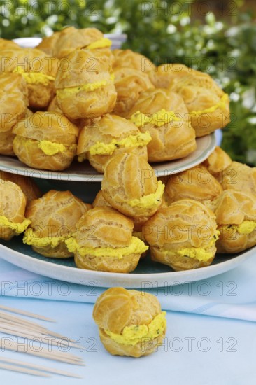 Swabian cuisine, mini cream puffs filled with goat's cream cheese, cream cheese éclairs,