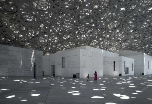 Visitors in the light rain of the Louvre Abu Dhabi, architect Jean Nouvel, Saadiyat Island, Abu