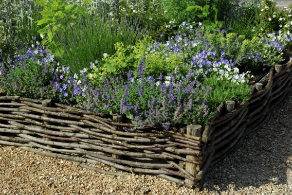 Flowerbed with willow fence