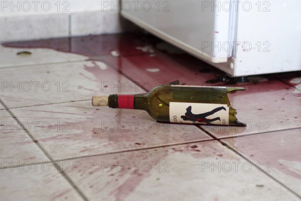 Glass bottle, broken, red wine, tiles, dirt, red, A red wine bottle has fallen on the floor. Shards
