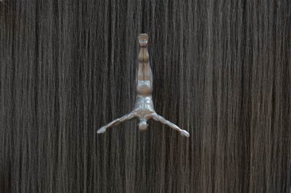 Interior view, The Waterfall, artificial indoor waterfall with life-size jumper sculptures,