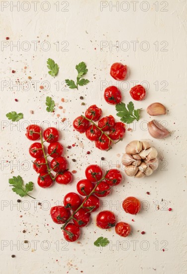 Baked branch, mini, cherry tomatoes, with spices and herbs, garlic, food background, top view, on a