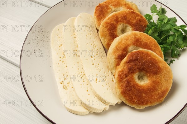 Mchadi, corn tortillas, traditional Georgian dish, corn bread, with Imeretian cheese, homemade, no