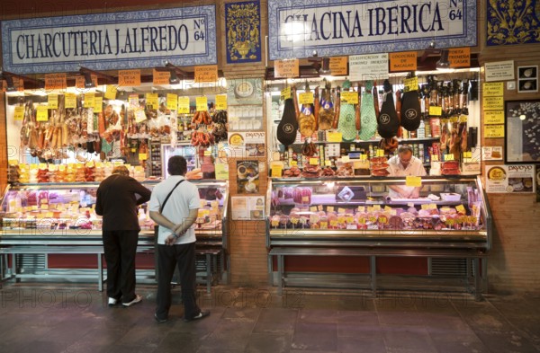 Butcher's stall in historic market building in Triana, Seville, Spain, Europe