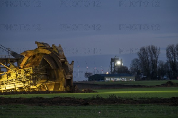 Two excavators are working around the hamlet of Lützerath, occupied by climate activists, the