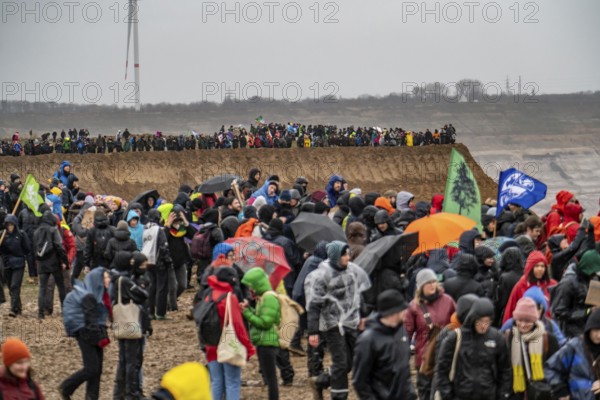 Many thousands of demonstrators march after a demonstration against the demolition of the lignite