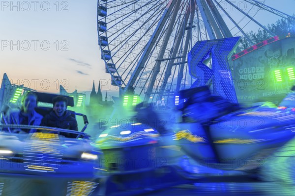 Deutz funfair on the Rhine, at Easter, funfair, break-dancer ride, Ferris wheel, Cologne Cathedral,