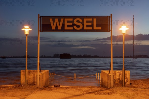 Rhine flood, riverside promenade in Wesel, the river water is already spilling onto the paths,