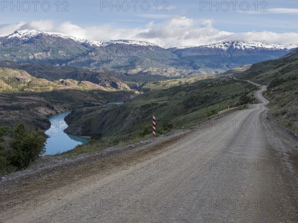 Road Carretera Austral north of Cochrane, gravel road along river Rio Baker, Patagonia, Chile,