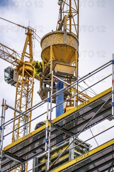 Concreting work on a construction site, new construction of a high-rise office building, facade of