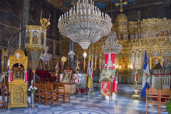 Magnificent interior of an Orthodox church with rich gold jewellery and large chandeliers, Panaghia