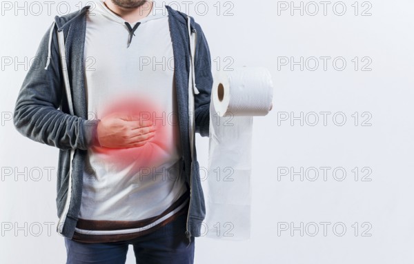Unrecognizable person with diarhea holding toilet paper roll. Diarhea and stomach problems concept