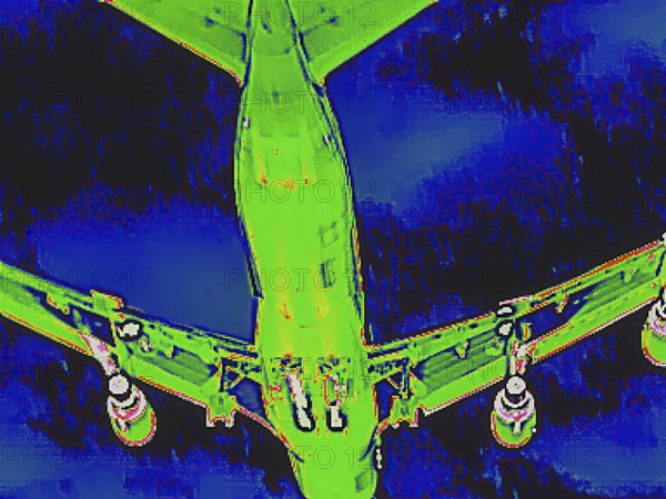 Aircraft on approach, bottom view. Thermal image or thermography, symbol photo, interpolated.