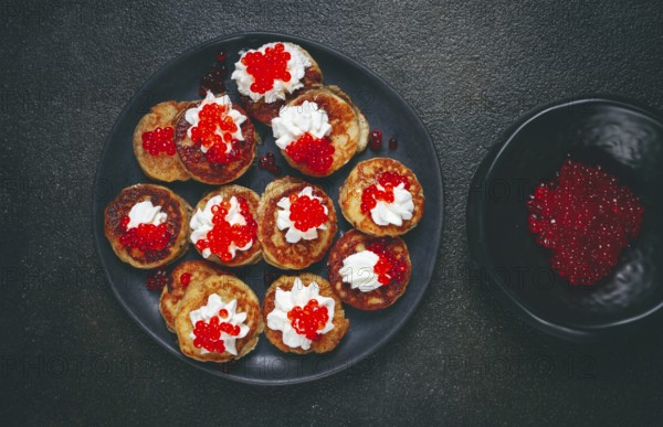 Demidoff pancakes, mini pancakes, with sour cream and red caviar, homemade, no people