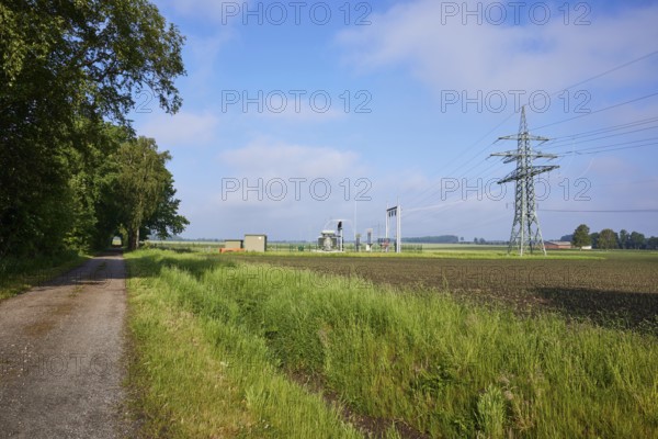 Substation in agricultural landscape with field path and trees near Beckdorf, district of Stade,