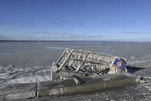 Frozen lake, ice and structures on iron ladder, Illmitz, Lake Neusiedl, Burgenland, Austria, Europe
