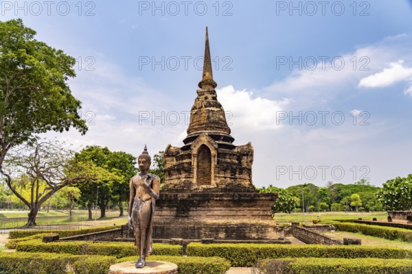 Buddha statue and chedi of the Buddhist temple Wat Sa Si, UNESCO World Heritage Sukhothai