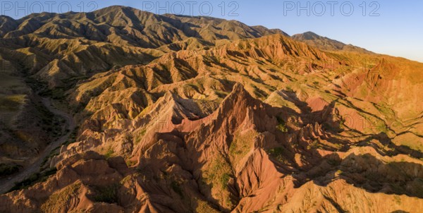 Aerial view, eroded mountain landscape, sandstone cliffs, canyon with red and orange rock