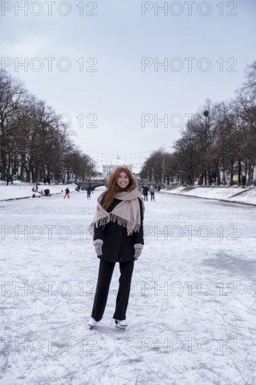 Ice skaters on the Nymphenburg Palace Canal, Nymphenburg in winter, Munich, Upper Bavaria, Bavaria,