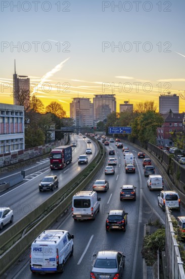 Evening traffic, partly with traffic jams, slow-moving traffic on the A40 motorway, skyline of