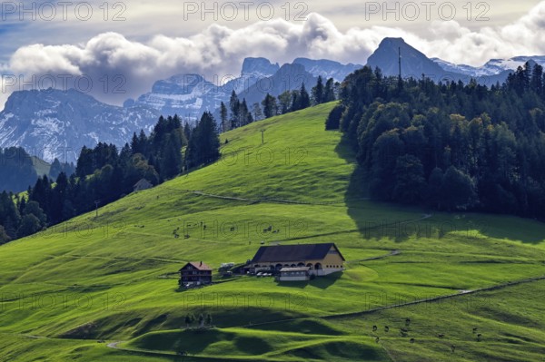 Farm and mountain range Einsiedeln, Switzerland, Europe