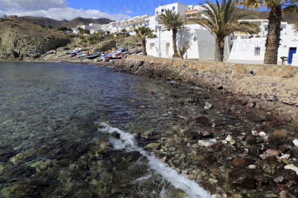 Small fishing boats and whitewashed houses, Isleta de Moro village, Cabo de Gata natural park,