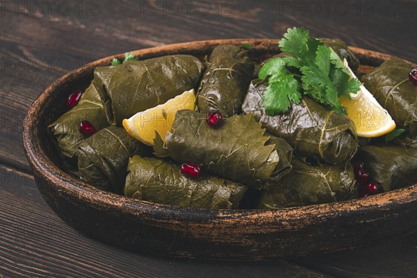 Dolma (Tolma) stuffed rolls, minced meat with rice, in grape leaves, top view, no people, close-up