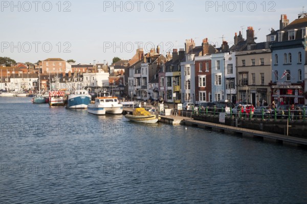 Colourful fishing boats in the harbour at Weymouth, Dorset, England, UK