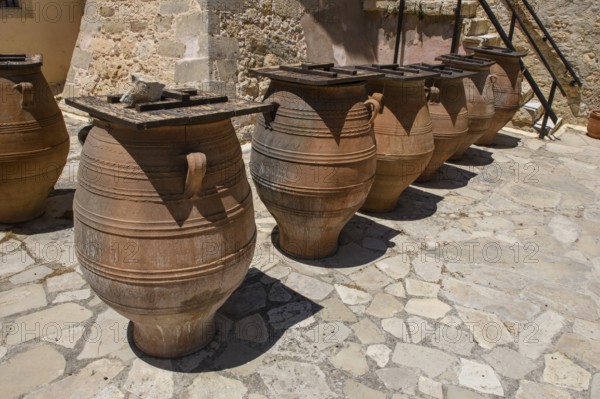 Large earthenware storage jars in the courtyard of Odigitria Monastery, Unesco Site Orthodox Greek