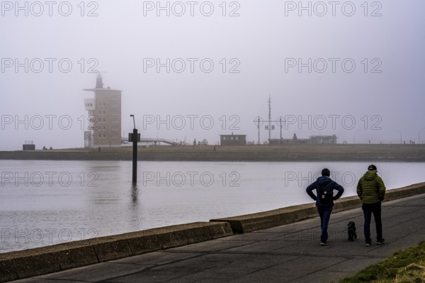 Thick fog in winter, hanging over the mouth of the Elbe into the North Sea, radar tower of the