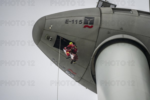 Height rescuers from the Oberhausen professional fire brigade practise abseiling from a wind