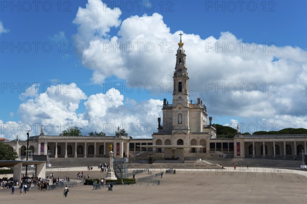Spacious square in front of a basilica with people and blue sky, Basilica of Our Lady of the