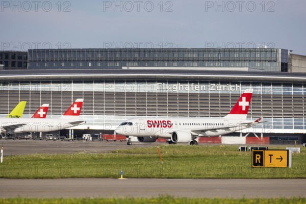 Swiss airline aircraft at Zurich Airport. Terminal and tower. Zurich, Switzerland, Europe
