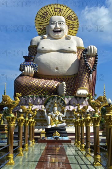 Laughing Buddha, larger-than-life statue in the Buddhist temple Wat Plai Laem, Koh Samui, Thailand,