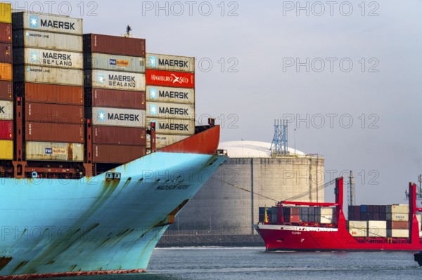 LNG import terminal tanks for liquefied natural gas in the seaport of Rotterdam, harbour tug brings