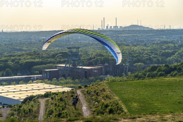 Paragliders on the Hoheward spoil tip, view to the west, North Rhine-Westphalia, Germany,