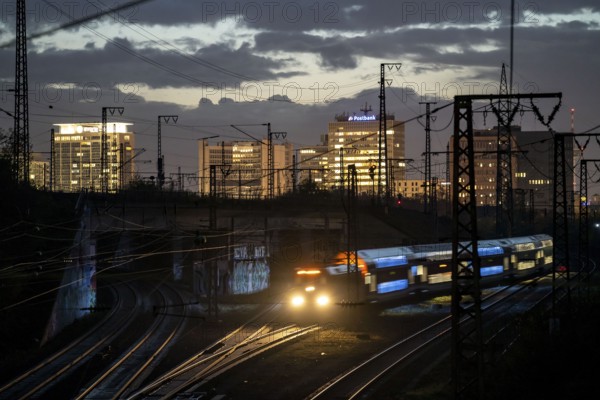 Skyline of Essen city centre, railway facilities in front of the main station, regional train,