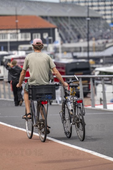 Cycle path in Amsterdam, two-wheel transport next to the bicycle, Netherlands
