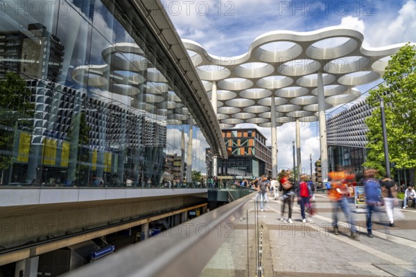Station forecourt of Utrecht Centraal station, people on their way to, from the station,