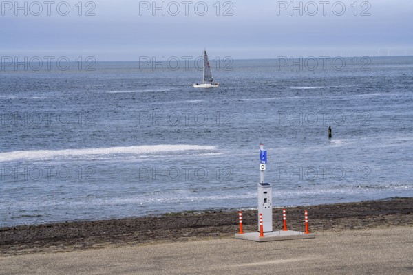 Westkapelse Zeedijk, North Sea dyke in Zeeland, can be used as a car park, parking ticket machine,