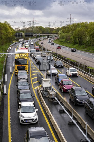 Weighing and barrier system on the A42 motorway, in front of the dilapidated motorway bridge over