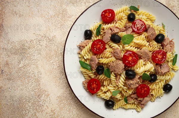 Tuna salad, fusilli pasta, olives and cherry, olive oil, homemade